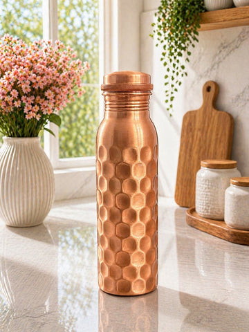 Pure Copper Water Bottle 900ml Hammered honeycomb texture bottle in a bright kitchen