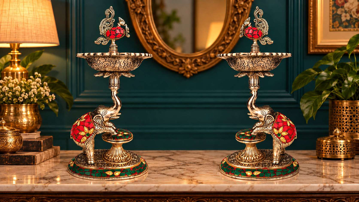Pair of 13 inch German silver elephant samai lamps with peacock finials, full front view
