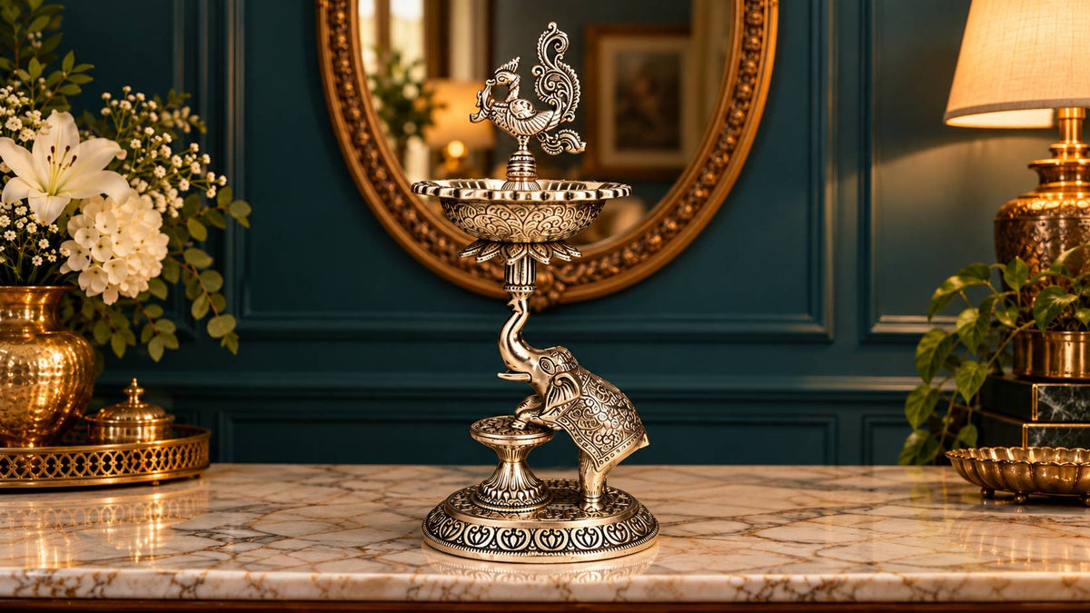 Single plain German silver elephant samai lamp with engraved peacock finial, full view