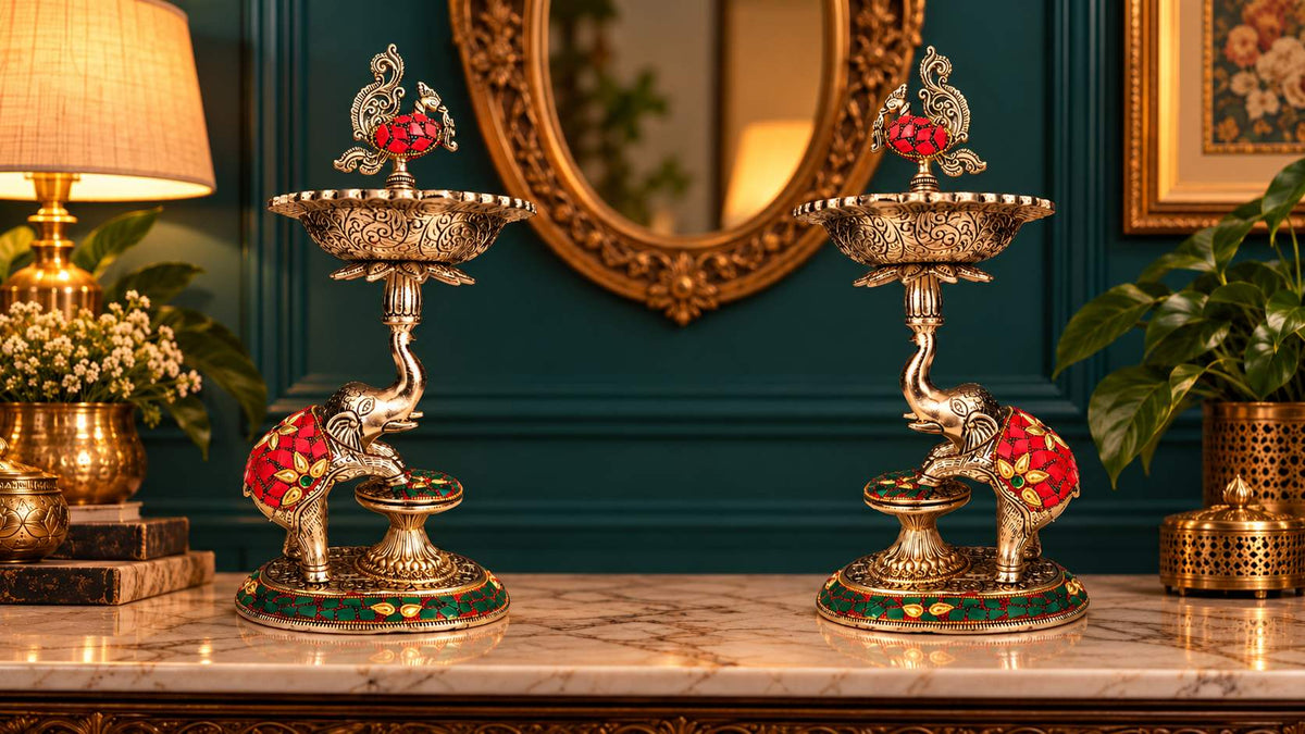 Low angle view of German silver elephant samai lamps showing raised trunk and engraved bowl
