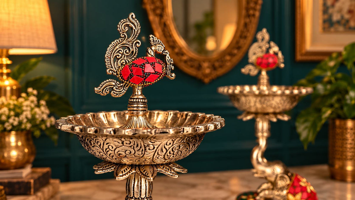 Close-up of peacock finial with red stonework and hand-engraved diya bowl