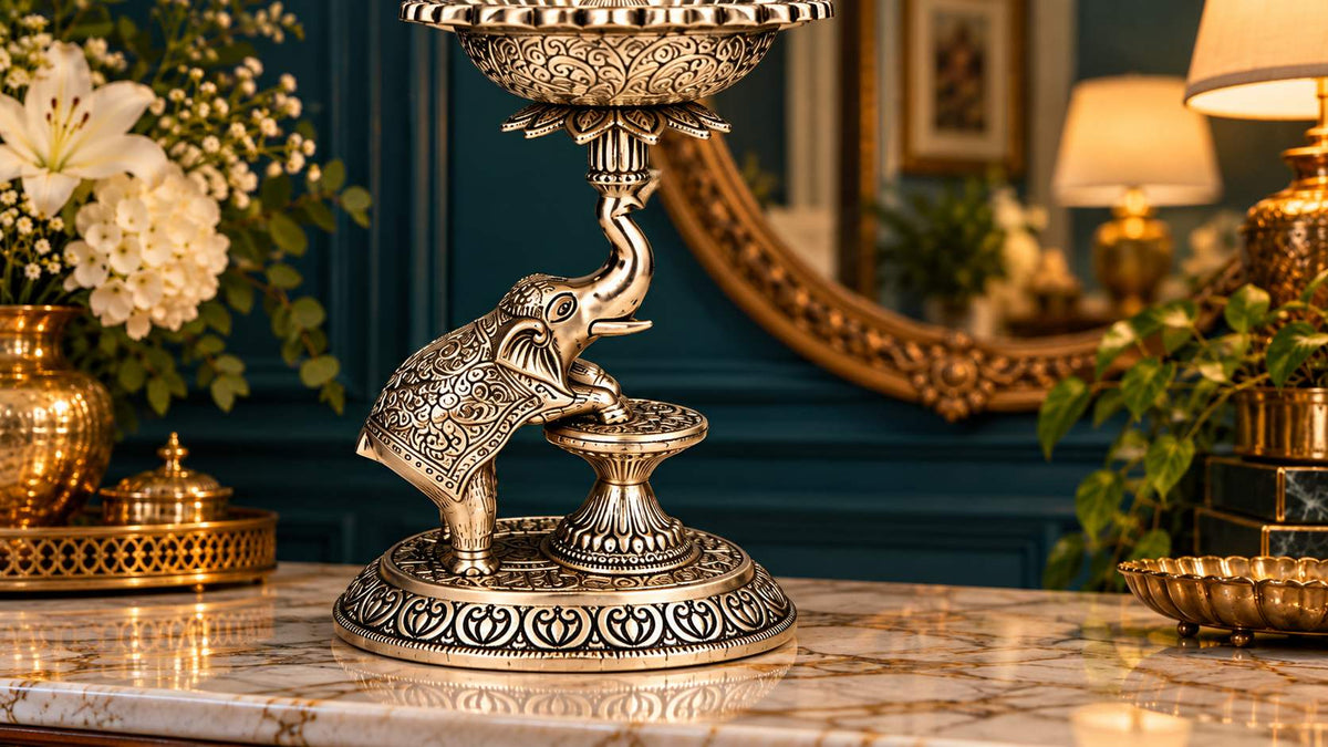 Close-up of elephant with engraved saddle blanket and heart-motif oval base