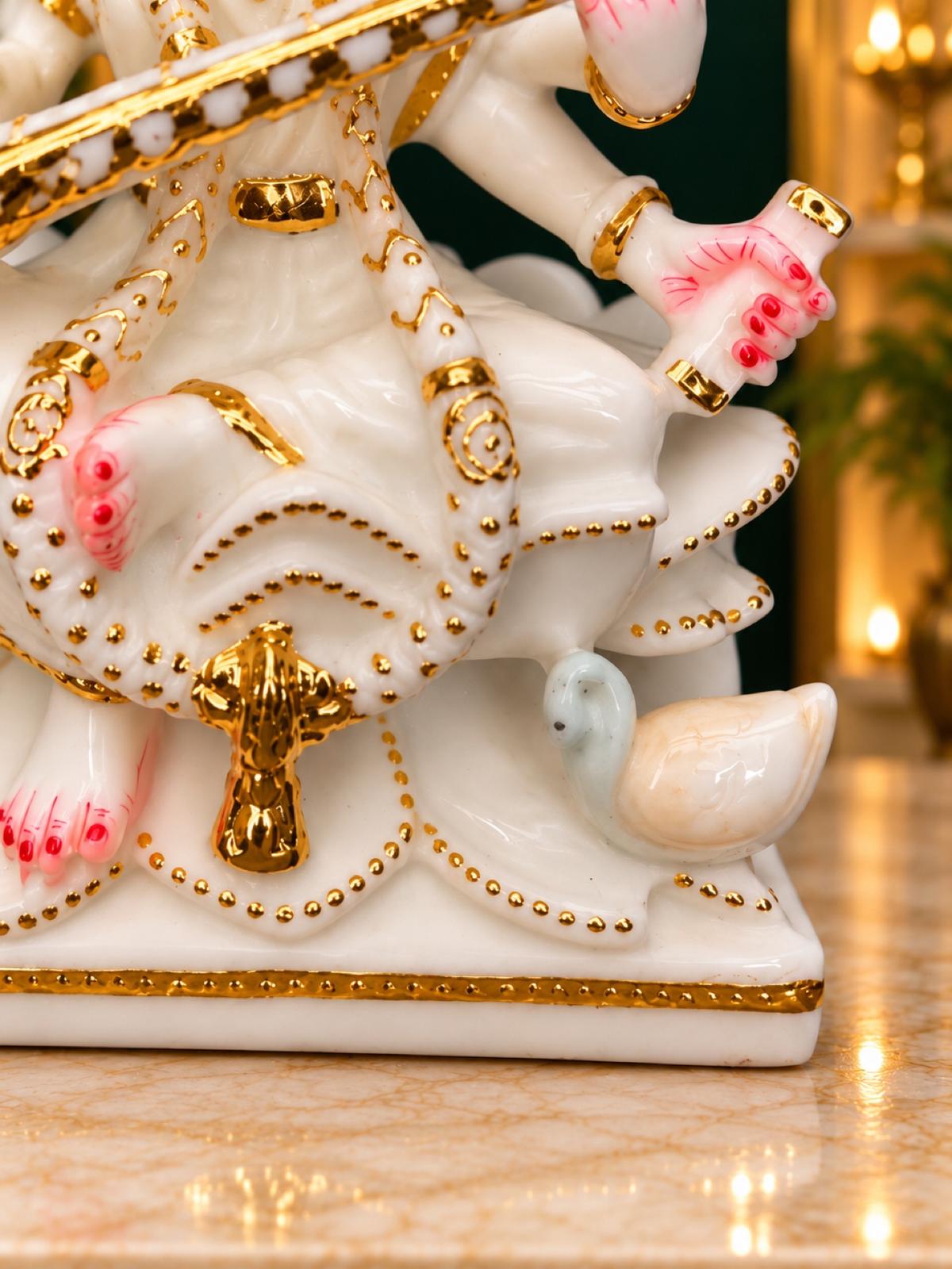 Close-up of Saraswati base with swan and gold beading
