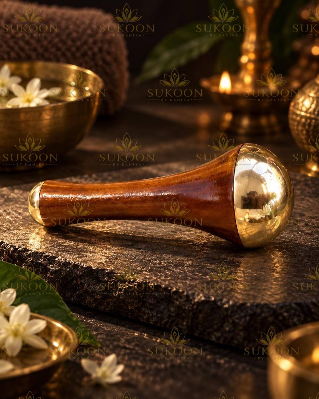 Close-up of polished kansa dome on teak wood face massage wand