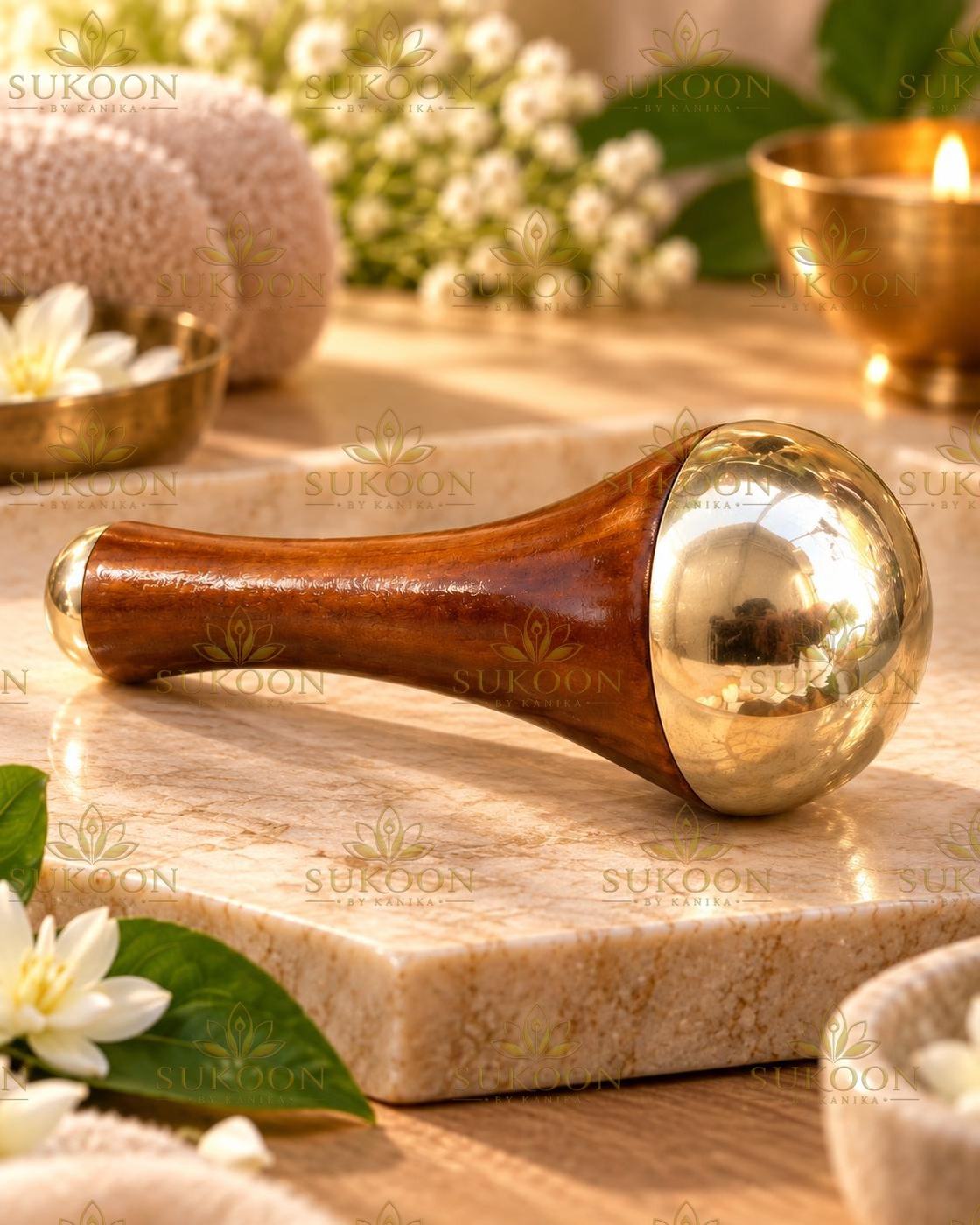 Kansa face wand on linen with dried flowers, spa styling