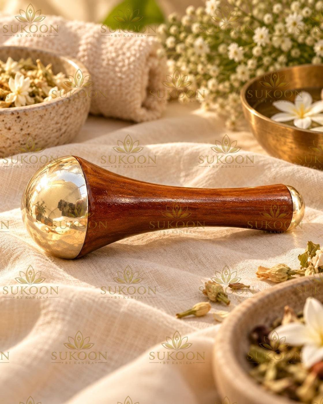 Macro shot of pure kansa massage dome and teak wood handle